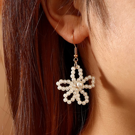 simple freshwater pearl ear hook hand-wound flower pendant earrings wholesale NHNZ566336's discount tags