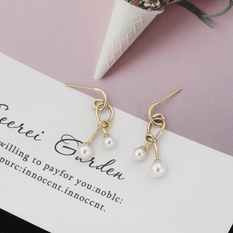 Exquisite fashion French criss-cross pearl earrings's discount tags