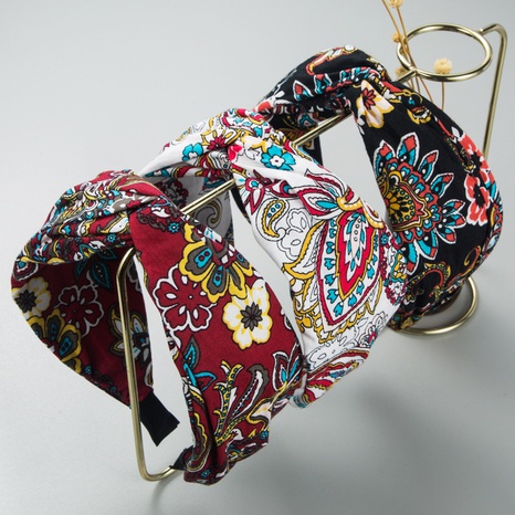 Korean fashion new retro fabric flower headband female simple knotted headband's discount tags