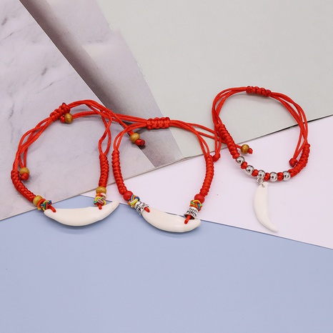 retro ethnic style white ivory pendant red hand-woven dog tooth bracelet's discount tags