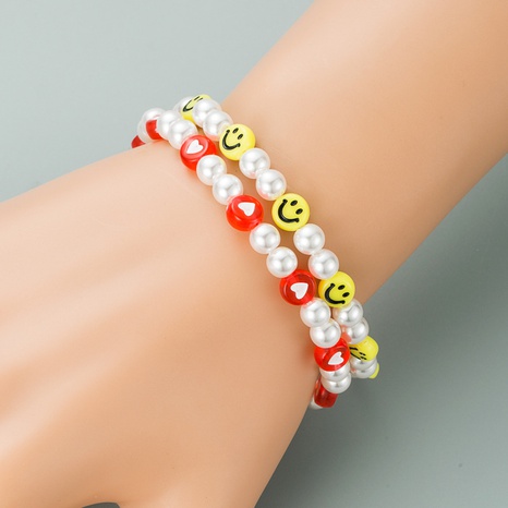 Korean new pearl acrylic heart-shaped smiling face bracelet's discount tags