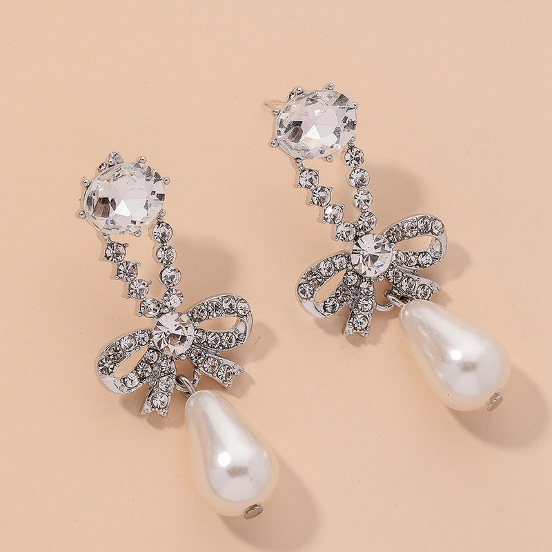 diamondstudded pearl bowknot earrings