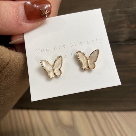 aretes retro de mariposa dorada's discount tags