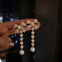 Fashion bowknot pearl long tassel earrings