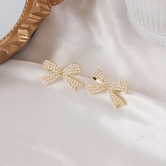Korea pearl bow alloy earrings wholesale