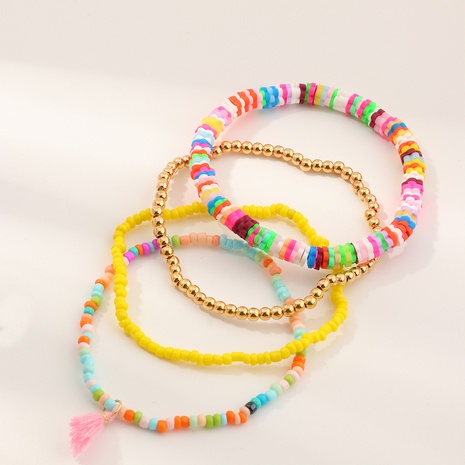 Ensemble de bracelet de perles de riz réglable avec pompons's discount tags