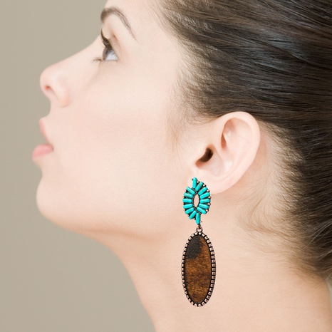 boucles d'oreilles exagérées en cuir turquoise imprimé léopard's discount tags