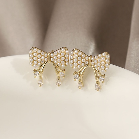 Nihaojewelry jewelry pearl bow zircon stud earrings wholesale's discount tags
