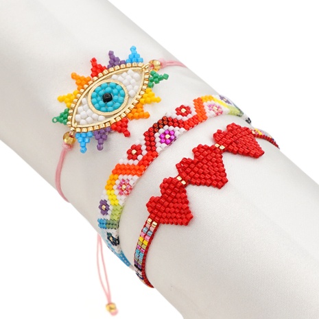 ethnic style simple rainbow lucky eye rice bead woven heart bracelet's discount tags