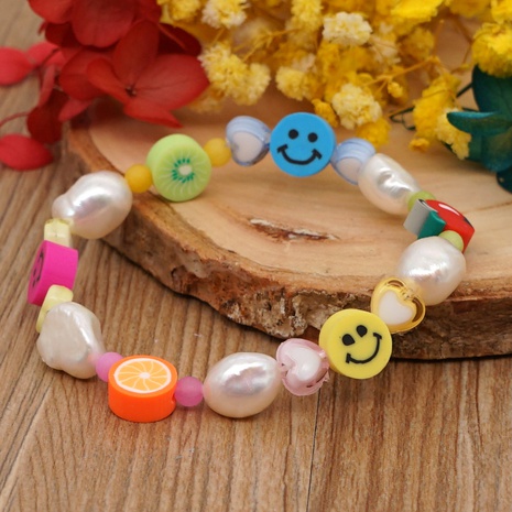 Korean style color fruit smiley soft pottery pearl bracelet's discount tags