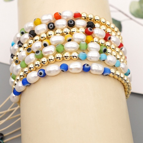 Bohemian simple eye pearl bracelet's discount tags