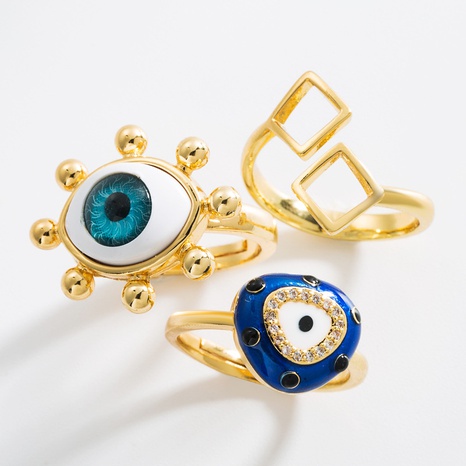 anillo abierto de circonita con incrustaciones de cobre con forma de ojo de diablo de moda's discount tags
