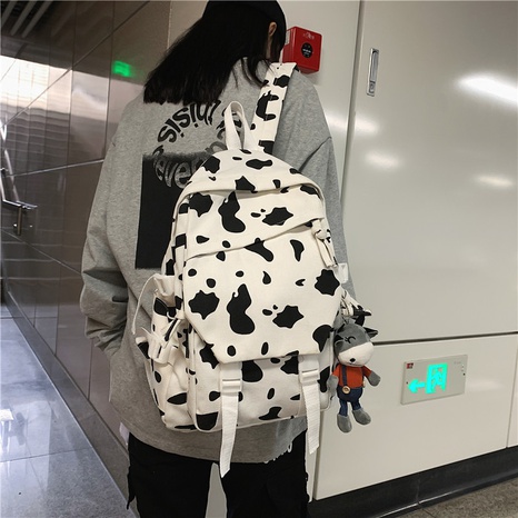 wholesale korean style cow pattern cartoon pendant canvas backpack nihaojewelry  NHAV382075's discount tags
