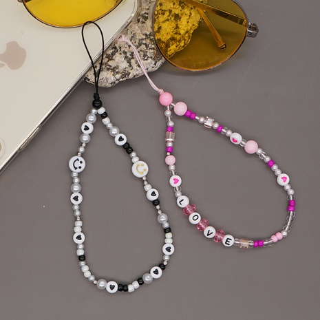 wholesale accessories letters imitation pearl glass white rice beads phone chain Nihaojewelry's discount tags