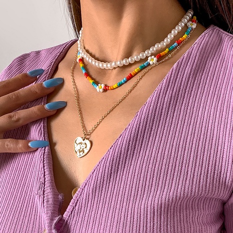 Großhandel Schmuck Herzform Anhänger farbige Blumen gewebt Nachahmung Perlenkette Set Nihaojewelry's discount tags