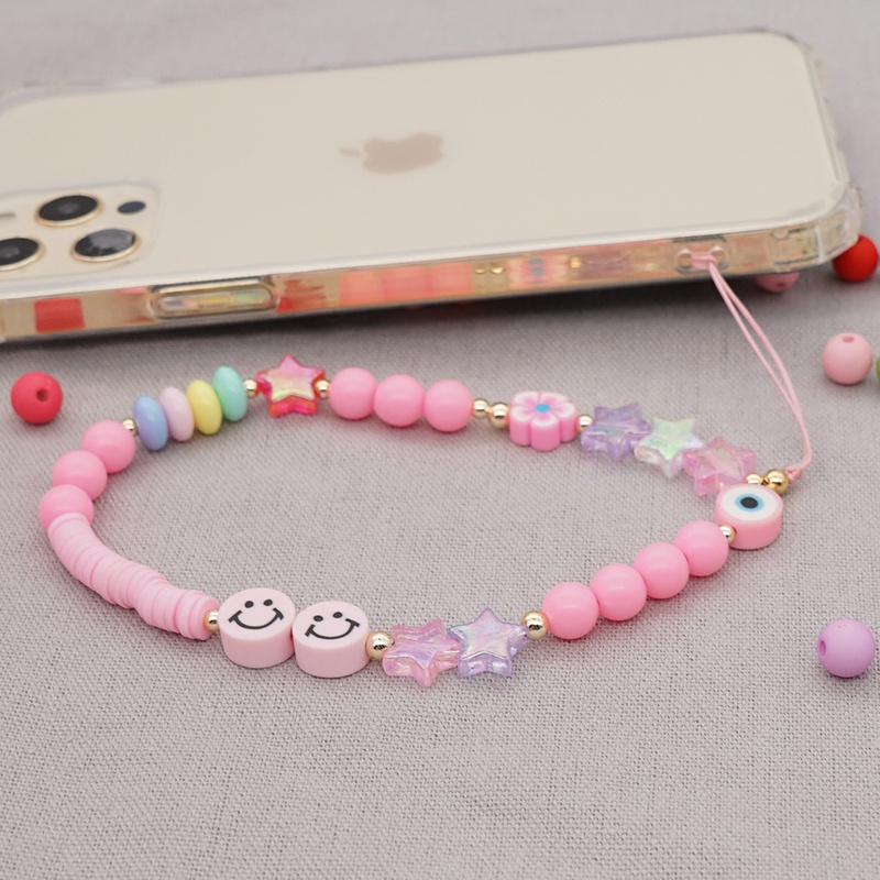 Nihaojewelry wholesale accessories acrylic pink round bead smiley face soft ceramic phone chain