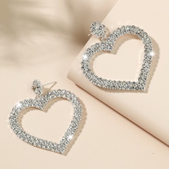 Boucles d'oreilles en alliage de diamants coeur creux de mode en gros Nihaojewelry