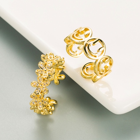 simple flor hueca smiley anillo de cobre abierto al por mayor nihaojewelry's discount tags