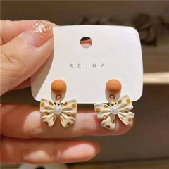New pearl bow stud earrings autumn and winter S925 silver needle personality South Korea temperament earrings