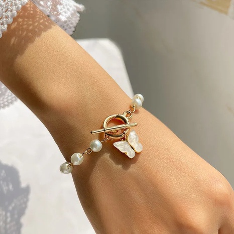 Corea moda retro mariposa perla OT pulsera al por mayor nihaojewelry NHPF416781's discount tags