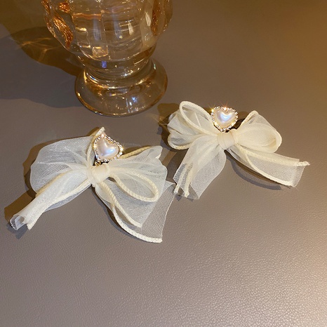 coeur perle diamant net fil bowknot boucles d'oreilles en gros nihaojewelry's discount tags