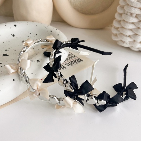 Korean three-dimensional metal heart bow ribbon simple thin hairband wholesale  NHMS586706's discount tags