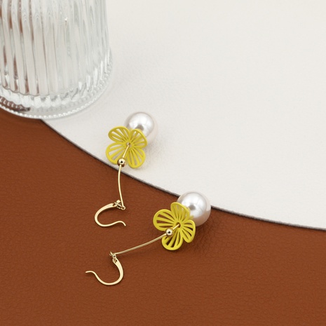boucles d'oreilles en perles de fleurs creuses de couleur unie à la mode classique's discount tags