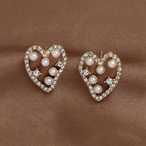 Fashion heart-shape rhinestone pearl alloy earrings wholesale NHNJ592922's discount tags