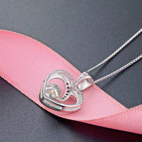 simple heart zircon hollow inlaid pearl s925 silver pendant NHDNF600389's discount tags