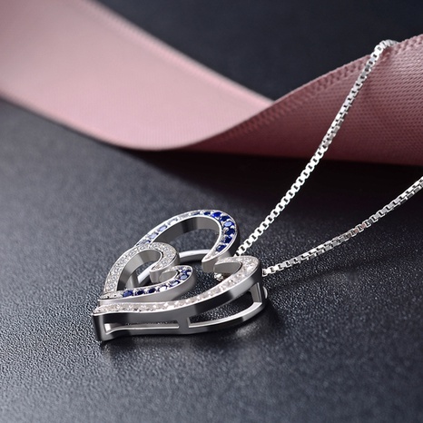 colgante de plata s925 con doble corazón de circón con incrustaciones de color de contraste de moda sin cadena's discount tags