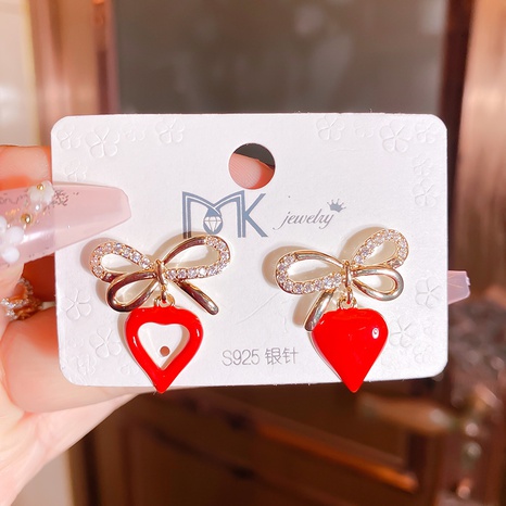 fashion copper hollow bow micro-set zircon heart-shaped oil dropping earrings NHMKA603508's discount tags