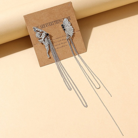 Korean creative asymmetric wings rhinestone earrings's discount tags