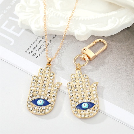 retro oversized full rhinestone eye palm metal necklace keychain hand pendant NHGO620834's discount tags