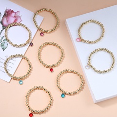 Europäisches und amerikanisches Armband aus einfachen farbigen Edelsteinen mit elastischem goldenem Perlenarmband