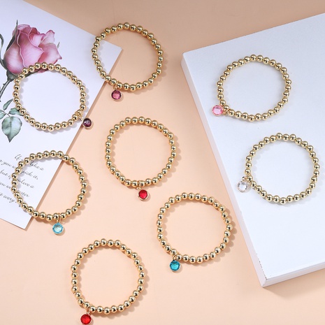 Bracelet élastique en perles dorées avec pendentif en pierres précieuses de couleur simple européenne et américaine NHJQ621393's discount tags