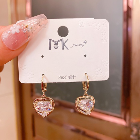 fashion hollow heart shaped inlaid zircon copper earrings wholesale NHMKA623031's discount tags