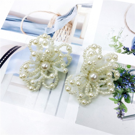 fashion hollow pearl stitching large flower earrings NHDOU579086's discount tags