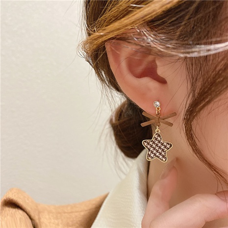 Korean autumn and winter women's bow star drop earrings wholesale  NHOT585841's discount tags
