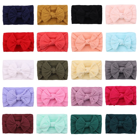 European and American children's solid color elastic bow headband wholesale NHYLX584156's discount tags