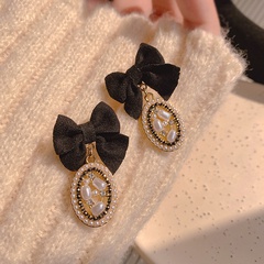 retro bow hollow pearl fabric fashion earrings wholesale