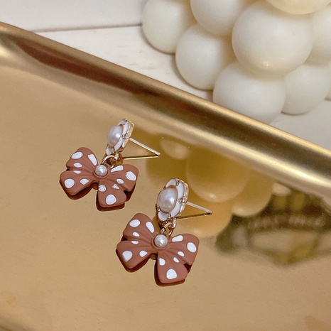 Korean imitation pearl wave point bow earrings sweet flower earrings wholesale  NHBY629625's discount tags