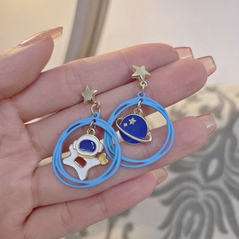 Korean creative star universe astronaut earrings fashion paint asymmetric earrings's discount tags