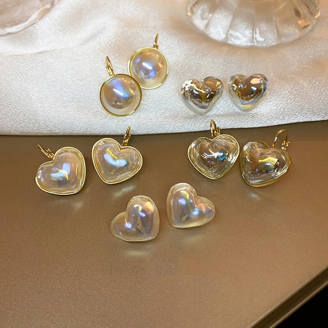 Fashion Pearl Heart Shaped Alloy Earrings Wholesale NHJBY630311's discount tags