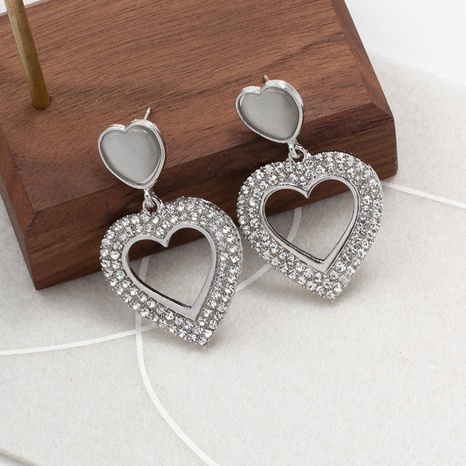 fashion solid color inlaid rhinestone heart shaped metal earrings's discount tags