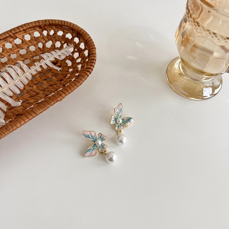 Retro painted butterfly enamel pearl long tassel alloy earrings's discount tags