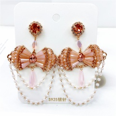 boucles d'oreilles vintage en forme d'arc exagéré avec perles en cristal et pampilles