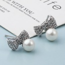 Fashion Classic Copper Inlaid Zircon Bow Pearl Stud Earringspicture11