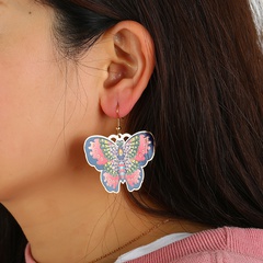 Gedruckte neue Art und Weise übertriebene kupferne Ohrringe des Schmetterlings, die Ölblume tropfen