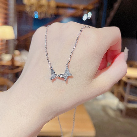 Fashion new titanium steel bow geometric inlaid zircon clavicle chain wholesale NHQYF628128's discount tags