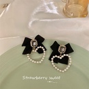 Korean autumn and winter new heart pearl retro bow alloy earringspicture8
